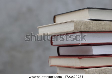 Stack of books on gray background