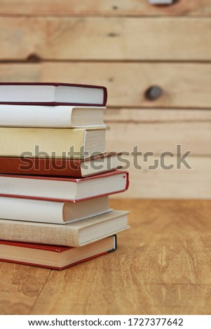 Books on a wooden background