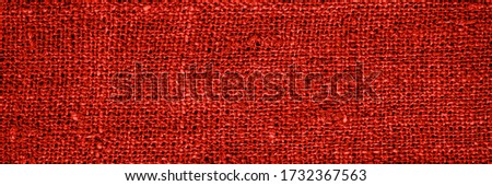 Red Ancient linen cloth, close up macro. Pure linen texture banner