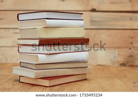 Books on a wooden background