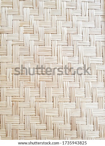 background photo of interlaced bamboo textured wall.