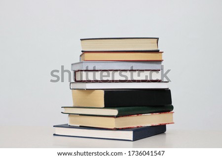 Stack of books on white background
