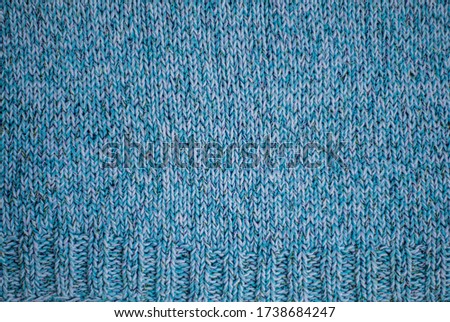 Knitted fabric, knitting abstract blue background, hand knitting texture, copy space background image, place for text
