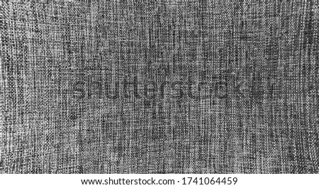 Detail of perspective monochrome background, closeup black and white cloth background, textile texture with dynamic pattern abstract style, close up of empty textile wallpaper gray color, clothing