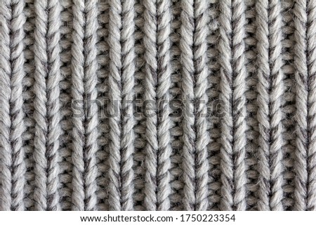 closeup of a soft gray fabric with a repeating pattern