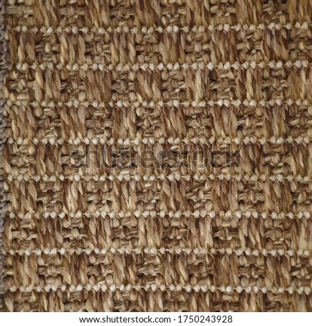 close up of woven carpet fabric texture pattern as abstract background