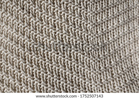 Textural white background. Knitted texture.