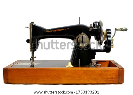 Old, retro vintage sewing machine on a white background