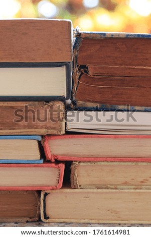 Close-up of multiple old books overlapping selective focus and shallow depth of field
