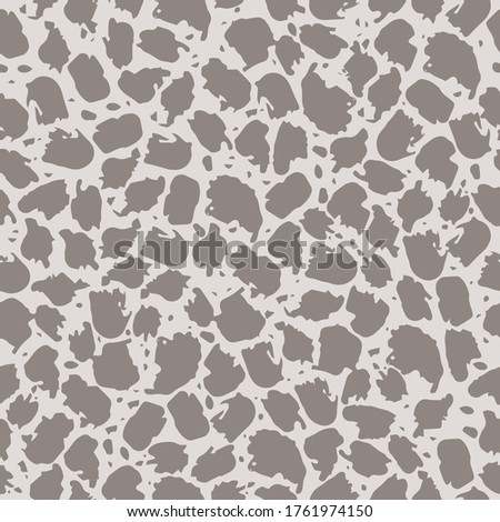 Seamless pattern with abstract spots on a light background. Animal print, spots, splashes. It can be used for decoration of textile, paper and other surfaces.