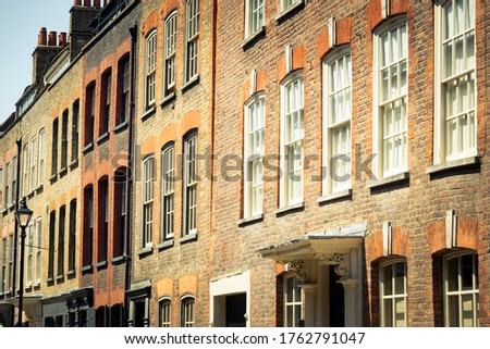London- Historic brick townhouse buildings in Spitalfields area of East London