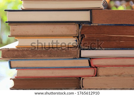 Close-up of multiple old books overlapping selective focus and shallow depth of field