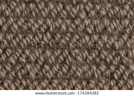 Closeup detail of brown carpet texture background.
