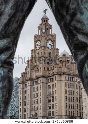Liver Buildings through the legs of a statue