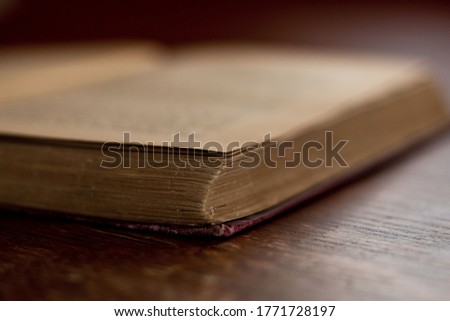 Open book on wooden table