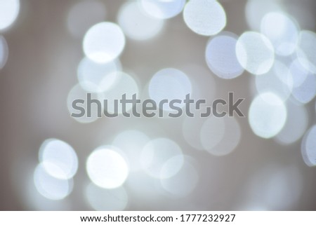 Winter light and white bokeh on a bluish background.
