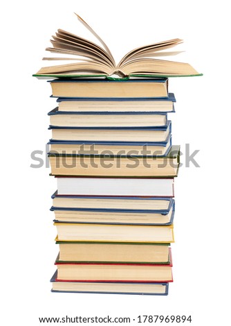stack of various books, on top an open book, items are isolated on white background, close up