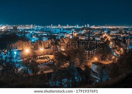Big, night city where buildings glow