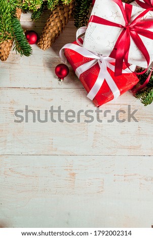 Christmas Holiday Background with Evergreen Pine Branches and Gift boxes
