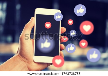 Human hand using smart phone with social media illustration