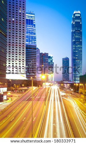 The highway light trails on the modern landmark buildings backgrounds in HongKong