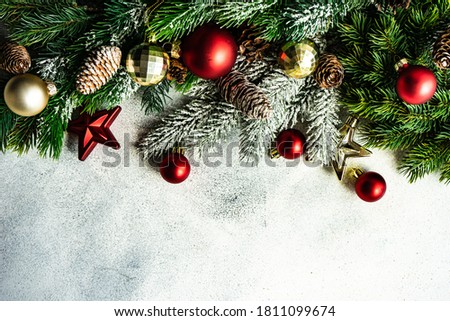 Christmas card concept with xmas tree and decor on concrete background with copy space
