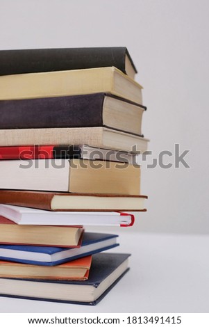 Books on white table with white background