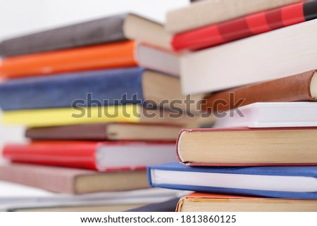 Books on white table with white background