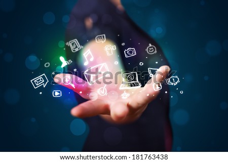 Young beautiful woman presenting colorful glowing social media icons