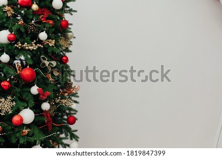 Christmas tree with gifts of garland lights for the new year as a white background