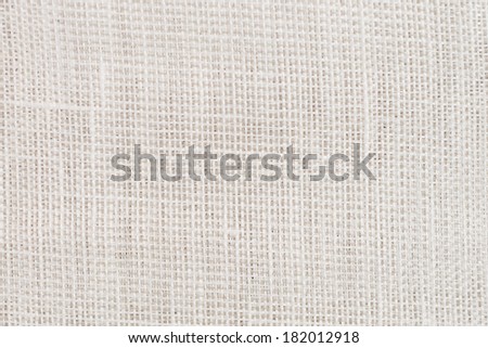 Closeup detail of beige fabric texture background.