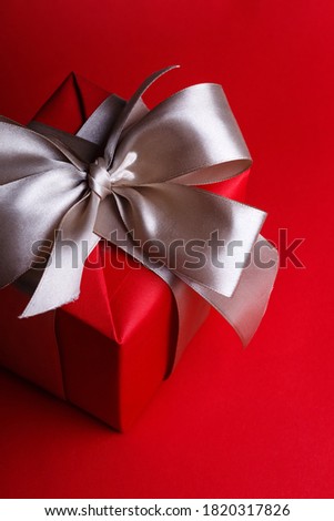 preparation for the holiday. a  gift on a red background. 
