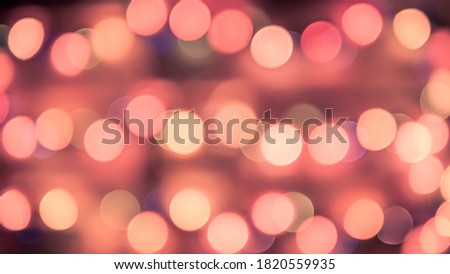 Bokeh lights are colorful on a black background,festive New Years flickering bulbs, beautiful colored circles