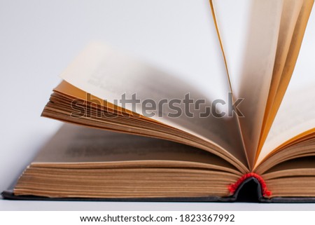 Open book on a white background with protruding pages.