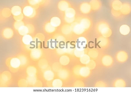 abstract background. light yellow blurry lights. bokeh. texture. concept for christmas, new year, holiday orange