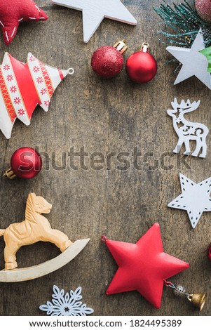 Set of red and white christmas decoration items arranged in circle with copy space for text. Greeting card cover