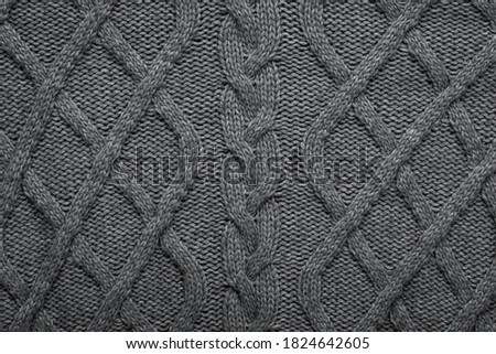 Knitted wool background. Grey texture knitted wool sweater