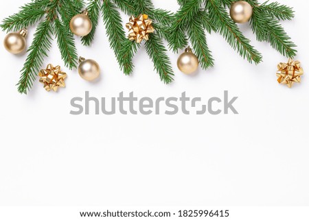 Christmas composition with fir tree branches and golden christmas balls on white background. Top view. Copy space - Image