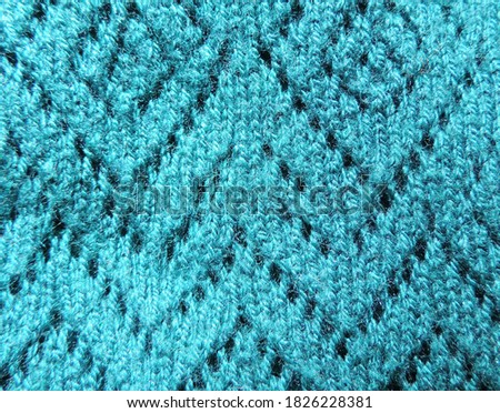  emerald color, green knitted fabric texture. Product from wool. Handwork        