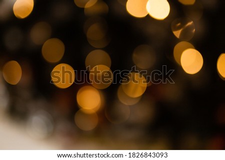 Christmas and New Year on blurred bokeh. Large multi-colored bokeh.