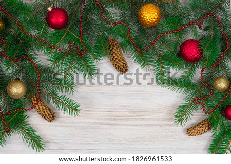 Christmas tree with decoration on a white wooden background. View from above. Place for an inscription. New Year. Christmas
