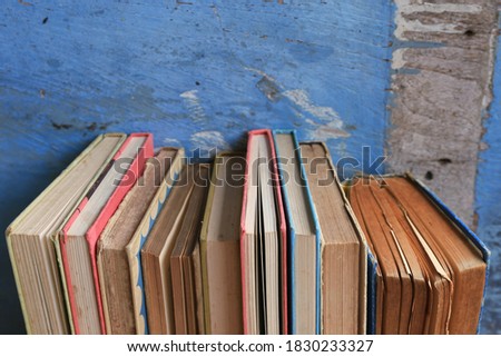 Close-up of old books arranged in the library Old wooden floor as background selective focus and shallow depth of field