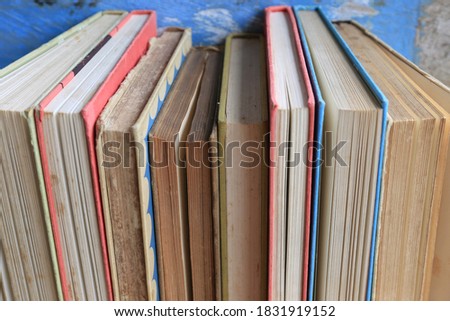 Close-up of old books arranged in the library Old wooden floor as background selective focus and shallow depth of field