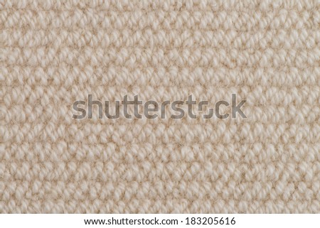 Closeup detail of beige fabric texture background.