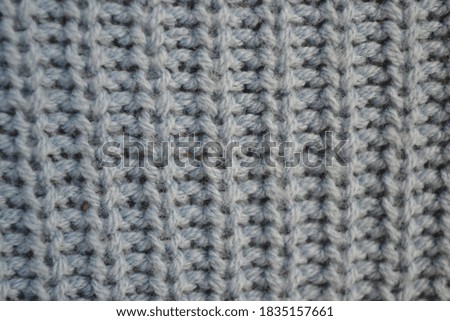 Blue knitted sweater texture, close up, vintage style