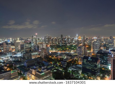 Aerial view of Bangkok Downtown Skyline with road street. Thailand. Financial district and business centers in smart urban city in Asia. Skyscraper and high-rise buildings at night.