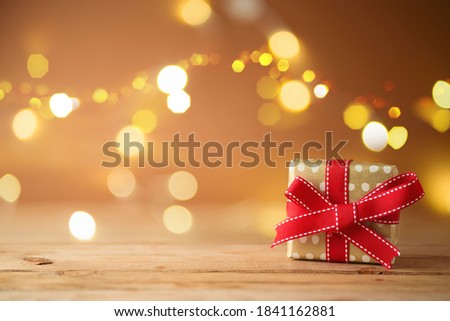 Christmas gift box over beautiful bokeh background