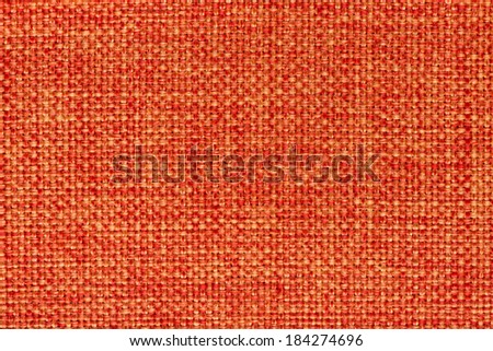 Closeup detail of orange fabric texture background.