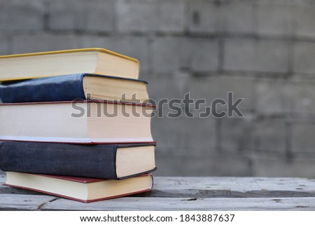 Books on a wooden box, books in an industrial setting