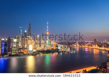 shanghai skyline in nightfall ,when the evening lights are lit on the huangpu river  